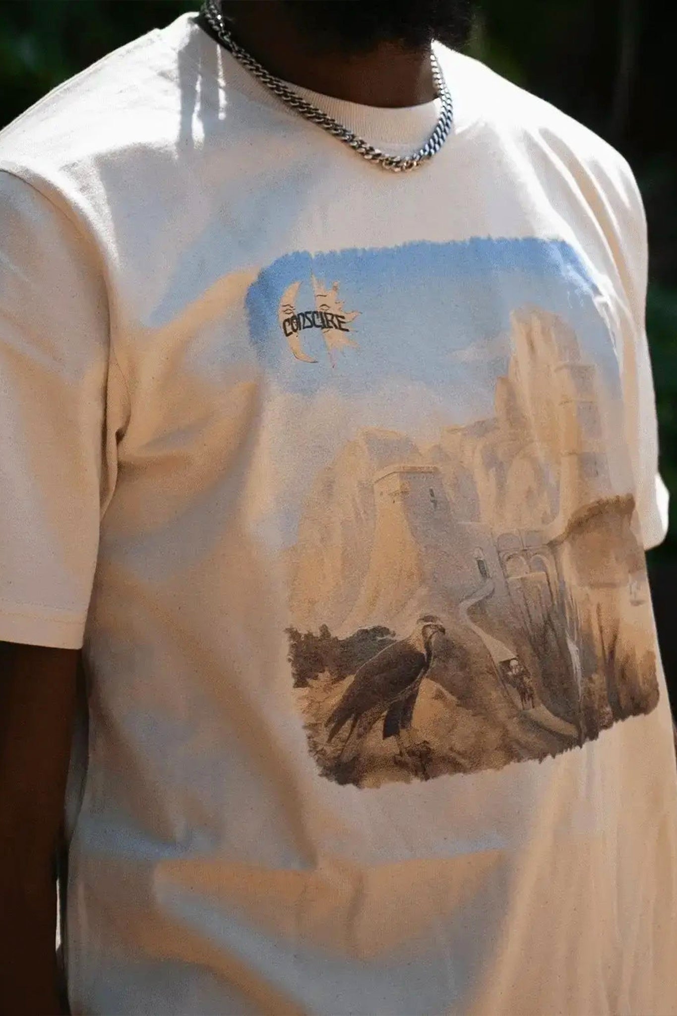 Close-Up Shot of Cream T-Shirt with Artwork Print