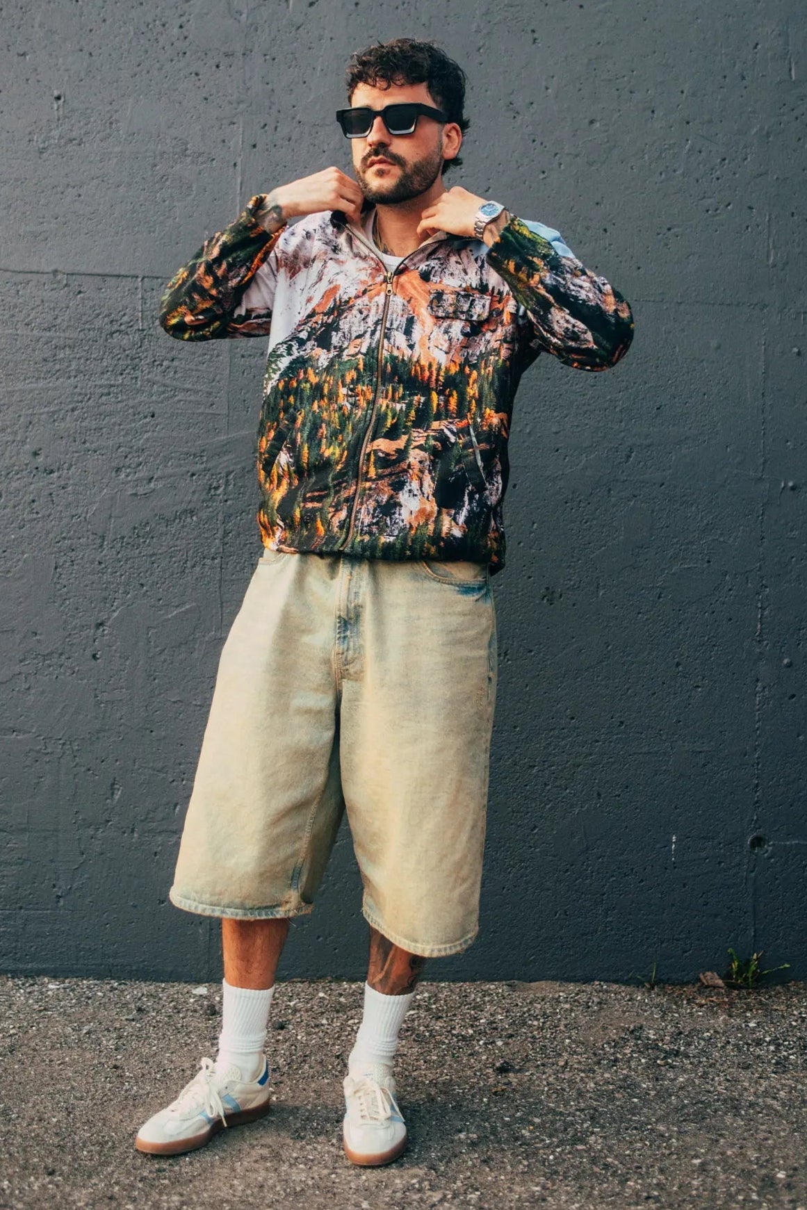 Street style zipup shirt with woodland pattern worn outside with grey background